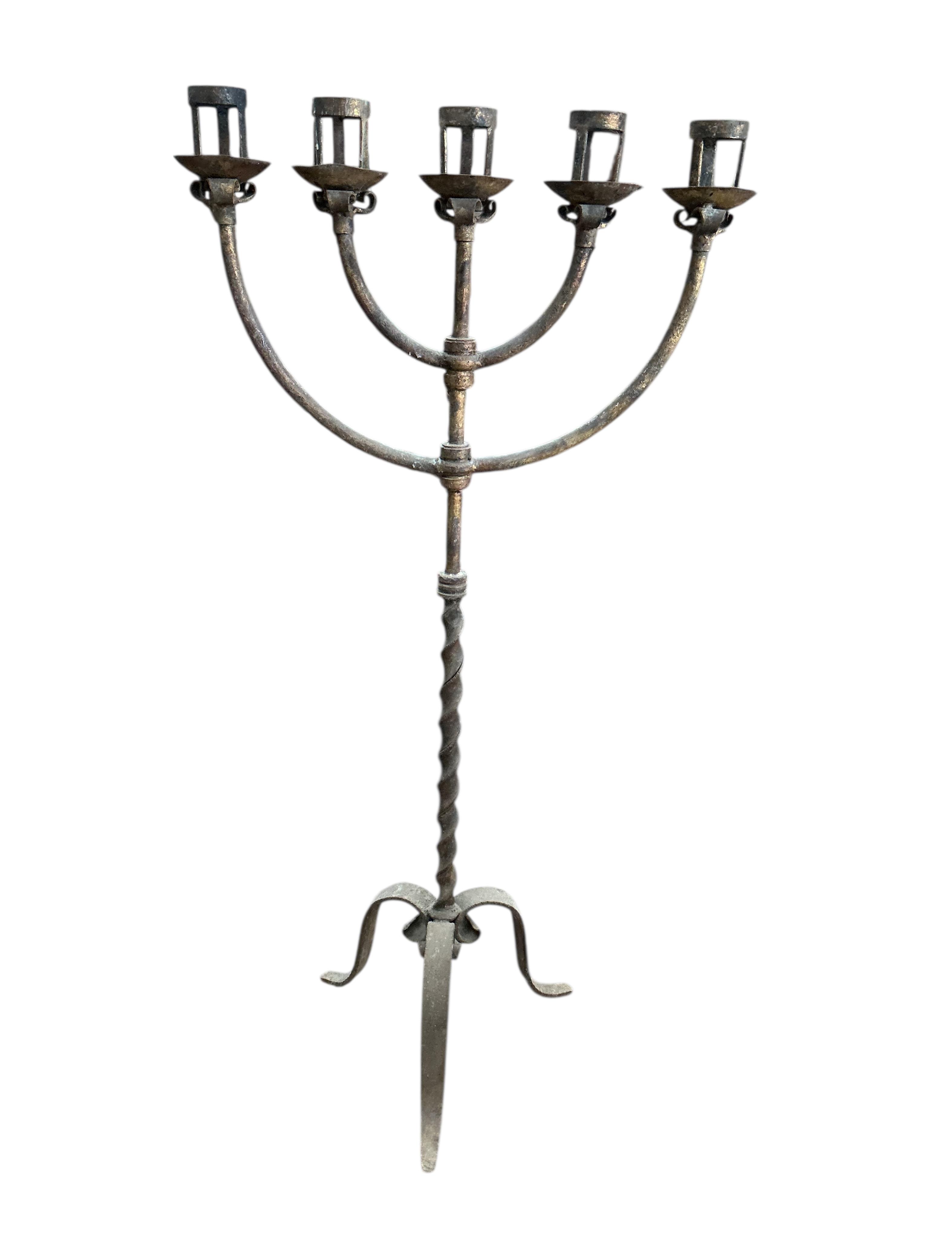 A wrought iron five branch tripod candlestand, height 134cm together with a wrought iron dragon head hanging light fitting